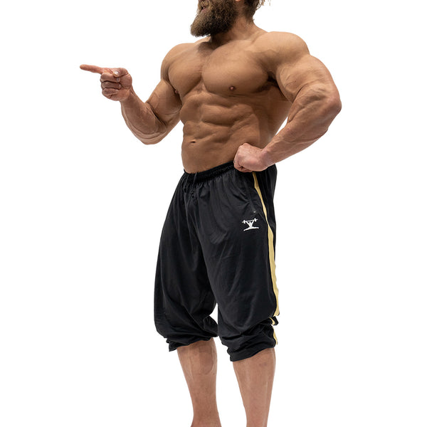 Jujimufu Lite Stretchy Pants Black And Gold Color - Showing wearing as Capri style